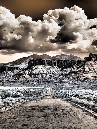 USA-Utah Infrared of road leading to Fisher Tower and large clouds Art Print